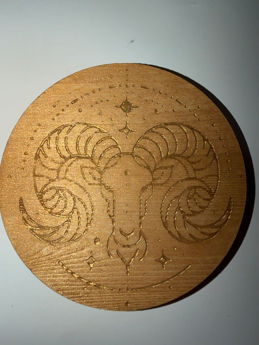 Circular wooden Aries pattern coaster